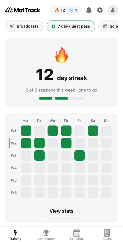 Mat Track training home showing a 12-day streak and a weekly grid of trained days